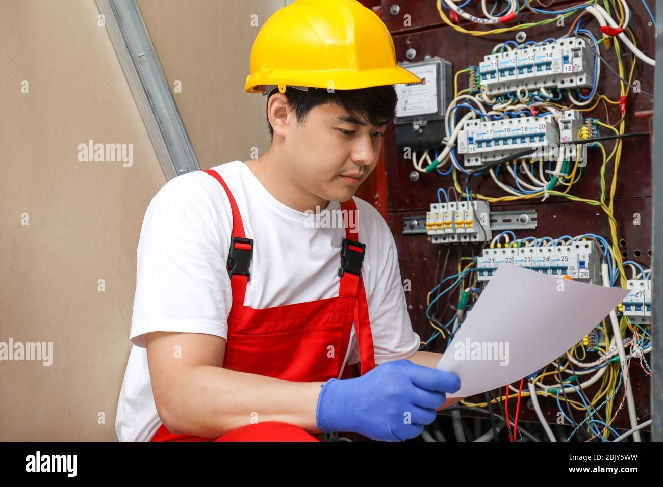 Electrician With Wiring Diagram Indoors Stock Photo Alamy